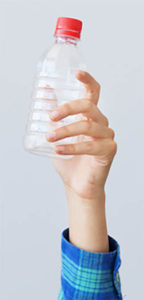 hand holding plastic bottle