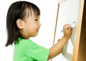 child at an easel
