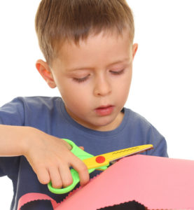 child using scissors
