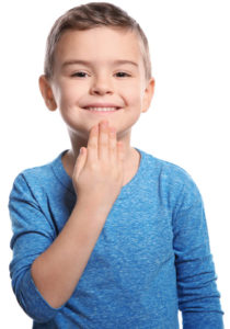 boy showing THANK YOU in sign language