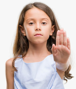 girl showing stop sign with hand