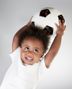 child with soccer ball