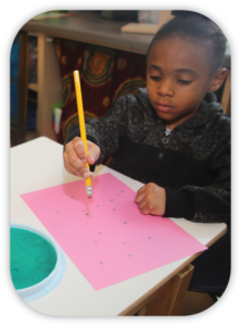 child making dot pictures