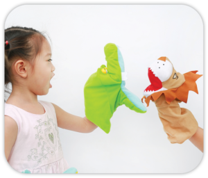 child with a hand puppet