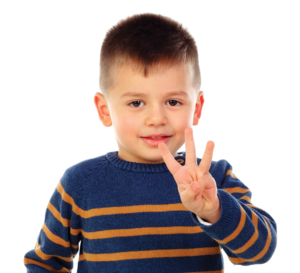 boy holding up 3 fingers