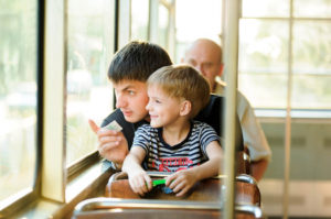 father and son on a bus