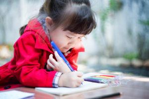 girl writing in her journal