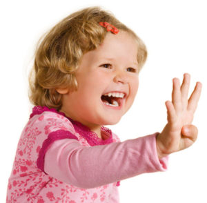 Laughing girl is showing four fingers