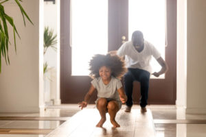father and daughter playing hopping game