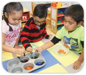 3 children using food coloring