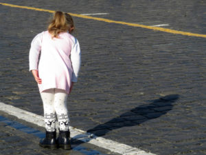 girl looking at her shadow