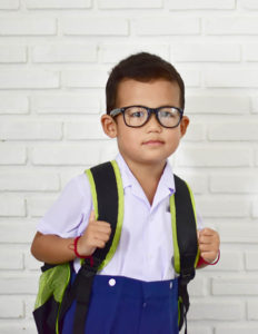 Boy with backpack ready for school